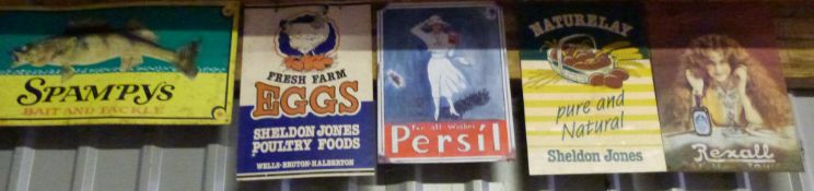 Eleven metal advertising signs including Persil, eggs, fishing tackle and Guinness, approximately 40