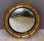 Circular convex butler's mirror with gilt frame, 35cm in diameter