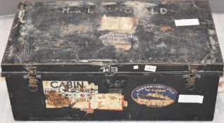 A vintage metal steamer trunk with labels and stencilling for Cunard White Star Line and 'Major L