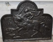 Cast iron fire back with figural decoration and Latin script, W82 x H72cm
