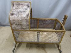 19thC painted bergère crib or cot raised on brass castors, W103 x D46 x H97cm