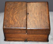 An oak tabletop stationery box with fitted interior, W38 x D21 x H29cm