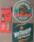 Three metal signs comprising Moosehead beer, Worthington Creamflow & McEwan's strong ale, largest 53