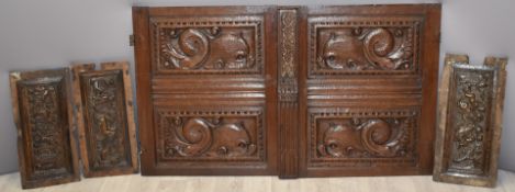 Five 18th/19thC carved oak panels/doors, largest 70 x 77cm