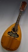 Paul Beuscher 20thC flat back mandolin with eight strings and two piece flame back
