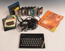 Sinclair ZX Spectrum with various games and books.
