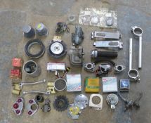 Motorcycle parts to include Britax lights, BSA M20 and Honda C92 pistons and various rings, horns,