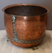 Riveted copper log bin, raised on shaped brass feet, diameter 56, H43cm