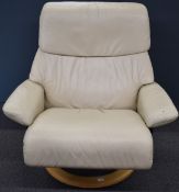 Stressless reclining armchair in cream leather