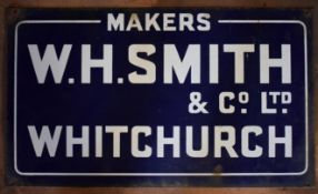 Vintage enamel advertising sign 'W H Smith Whitchurch', 35.5 x 61cm PLEASE NOTE this lot is