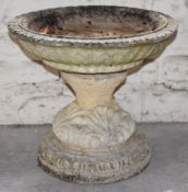 A contemporary stone figural garden bird bath, H72cm