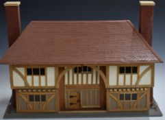 A 1:16 scale doll's house with lift off roof and first floor, electric lights, fireplace etc, W66