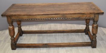 19th/20thC oak peg jointed dining table with carved frieze and straight skeleton unifying all four