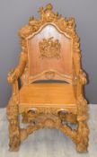 A figurally carved oak chair with armorial, W70 x H128cm