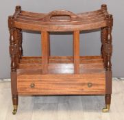 Mahogany Canterbury with single drawer and turned decoration raised on brass castors, W48 x D34