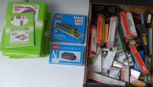 A collection of N gauge model railway kits, accessories and boxes including Metcalf buildings, PECO,