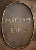 Vintage bronze or similar and enamel advertising sign 'Barclays Bank Ltd', 61cm maximum diameter