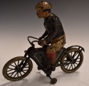 Lehmann clockwork tinplate model motorcycle and rider with blue and cream livery.
