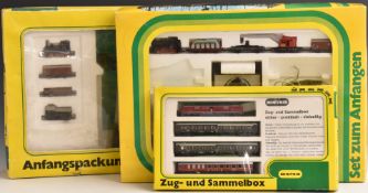 Three Hornby Minitrix N gauge train sets 1028, 1034 and 71065, all in original boxes.