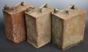 Three vintage 2 gallon petrol cans comprising Shell, Esso and a War Department example dated 1942
