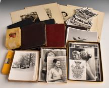 A large collection of c1950s photographs, loose and in albums, including glamour, vintage