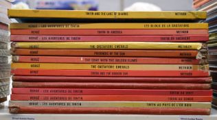 Twelve various Tin Tin books.