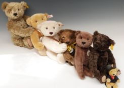 Seven Steiff Teddy bears including Classic 1909 and one with a growler, largest 47cm tall,