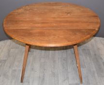 Ercol light elm dining table, W123 x D107 x H72cm
