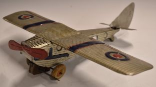 Mettoy or similar tinplate model aeroplane in silver, blue and red livery.