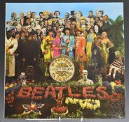 The Beatles - Sgt Pepper's Lonely Hearts Club Band (PCS 7027) record, cover and insert appear at