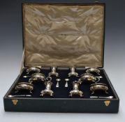 Indian silver cruet set in original fitted case, comprising two each of open salts with blue glass