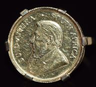 A 9ct gold ring set with a 1/10 Krugerrand, 5.8g, size K
