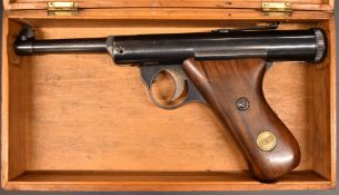 Haenel Mod 28 .177 air pistol with logo inset to the shaped wooden grips and adjustable sights,