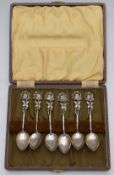 Cased set of white metal teaspoons with floral finials, marked 830, weight 53g