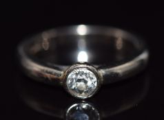An 18ct white gold ring set with a round cut diamond of approximately 0.3ct, 4.8g, size H