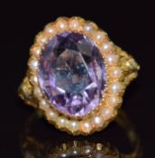 Edwardian 18ct gold ring set with an oval cut amethyst and seed pearls, London 1908, maker J.C, 5.