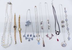 A collection of jewellery including Swarovski necklace, watches, two suites of silver jewellery by