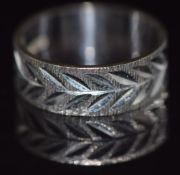 A 9ct white gold ring with bright cut decoration, 4.2g, size N/O