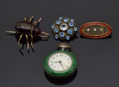 A silver fob watch set with enamel depicting a couple, and three brooches