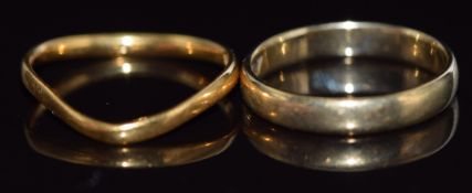 A yellow metal wedding band / ring marked 333 (1.9g, size K) and a 22ct gold ring1.6g, size K