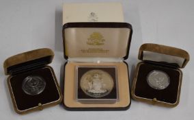 Two cased Russian Olympic silver coins and a Bahamas cased silver ten dollar
