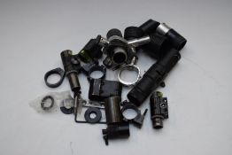 A collection of various gun or rifle sights and scope mounts including Parker-Hale, Andrew Tucker