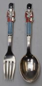 Danish sterling silver novelty spoon and fork with enamelled decoration of guardsmen with bearskins,