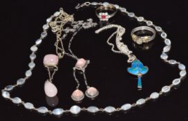 Two silver necklaces set with rose quartz, a silver pendant set with green and blue enamel, a