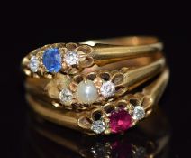 An 18ct gold ring made up of three rings, one  set with a pearl and diamonds, the other a sapphire