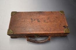 Leather 20 bore or .410 shotgun cartridge carry case bound in brown leather with brass lock and