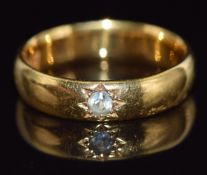 A 22ct gold ring set with paste in a star setting, Birmingham 1910, 5.7g, size M, in Goldsmiths &