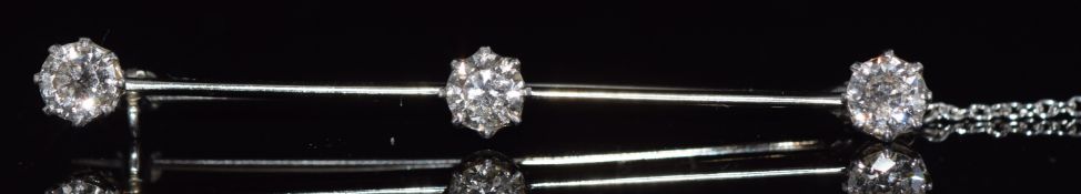 An 18ct gold & platinum brooch set with three transitional cut diamonds, each approximately 0.5ct,