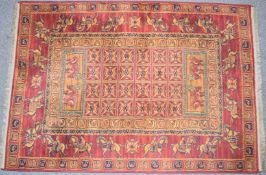 Persian rug with mounted rider surround on a wine ground, 195 x 134cm