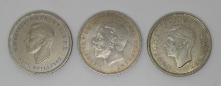 Three English crowns comprising George V 1935 'rocking horse', Coronation George VI 1937 and a